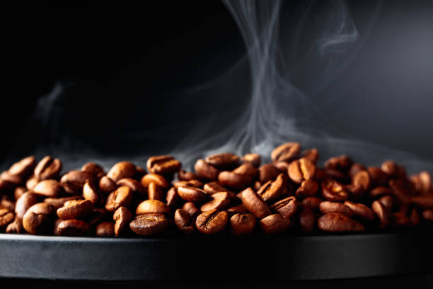 istock Steaming coffee beans on a black background. 1454419133