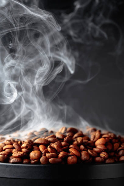 istock Steaming coffee beans on a black background. 1454419138