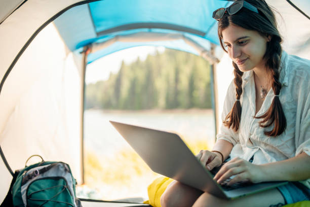 istock Balancing work and leisure on a camping vacation. 1454419199