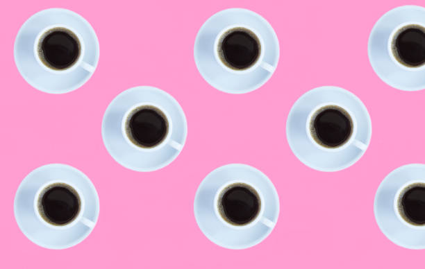 istock Coffee cup on the pink background. Flat lay. Pattern. Top view. 1454421686