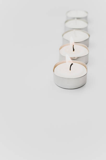 istock burning pure wax scented tea lights on a white background with space for text 1454425784