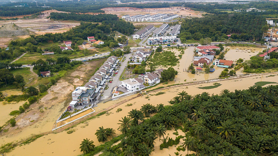 DENGKIL, MALAYSIA - NOV 17, 2022: Areal view of Dengkil district from flooding that causes damage of the infrastructure and housing area. Selective focus, contains dust and grain