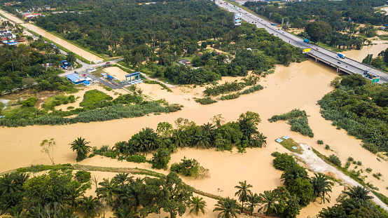 DENGKIL, MALAYSIA - NOV 17, 2022: Areal view of Dengkil district from flooding that causes damage of the infrastructure and housing area. Selective focus, contains dust and grain