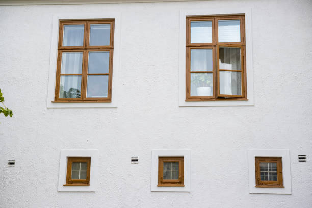 istock White Wall background with brown windows background texture of house 1454426903
