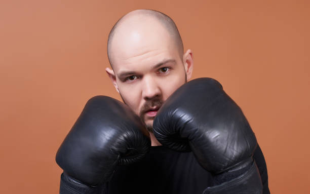Portrait of a young boxer athlete with a beard. stock photo