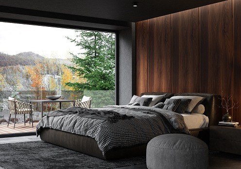 Modern matte black interior with dark wooden wall concept. Apartment master bedroom interior.
Modern king size bed with black gloss side tables. 
Black carpet and ceiling with down lighters. Light stone marble flooring. 3d rendering.