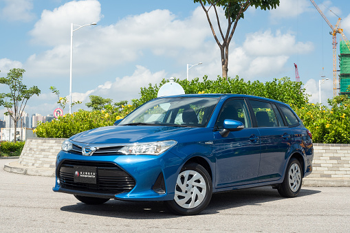 Berlin, Germany - 10 July, 2019: Toyota Camry Hybrid on a street. The Camry is one of the most popular sedan vehicles in the world.