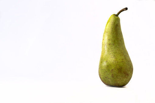 A pear-whitebackground showcases a ripe, juicy pear, bursting with sweetness and nutrients, ideal for a healthy snack or culinary use.