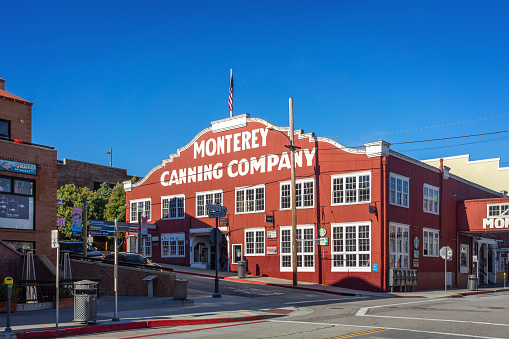 Monterey, CA, USA – December 16, 2022: Street view of the historic Monterey Canning Company building in Cannery Row in Monterey, California.
