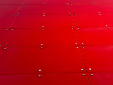 Red glass pattern abstract background. Red glass facade of the building. Red background.