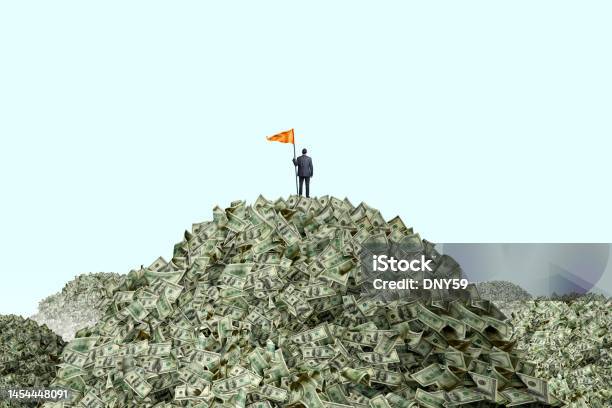 Man Planting Flag On Piles Of Cash Stock Photo - Download Image Now - Currency, Stack, Heap