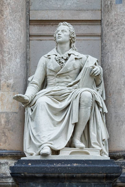 Dresden, Germany - December 6, 2017: Statue of Friedrich von Schiller at the front facade of the Semperoper. The statue was created in 1841 by the German sculptor Ernst Rietschel (1804-1861).