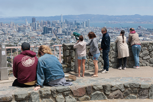 Tourists take in the view of San Francisco from the viewpoint at Twin Peaks