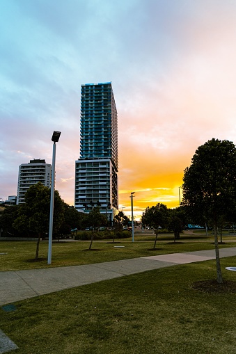 Sunset behind the Sky Tower on Marine Parade Southport