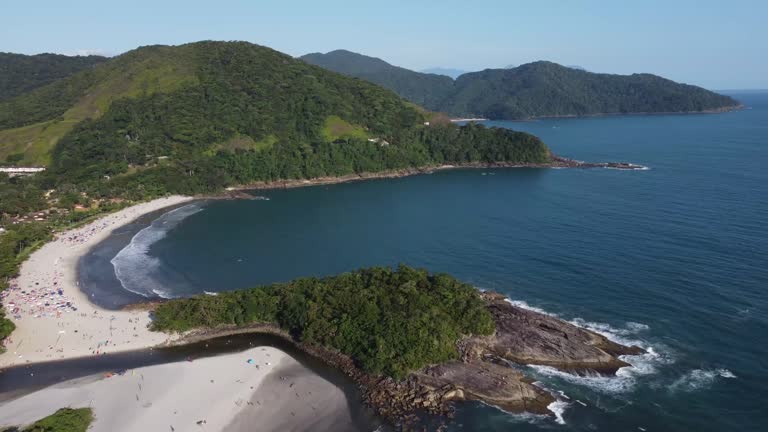 Amazing paradise beach in the middle of nature with green mountains