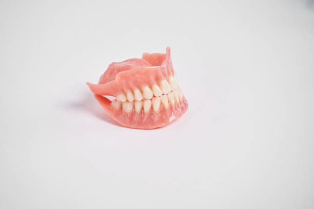istock Dental prostheses on a white background. Beautiful teeth ceramic press ceramic crowns and veneers. 1454451486