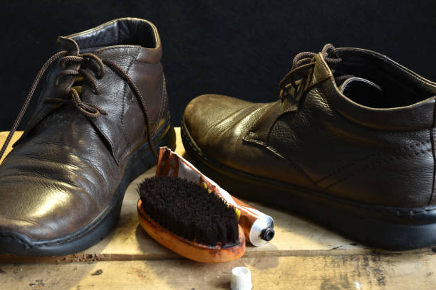 istock Brown leather shoes and brush. 1454452857
