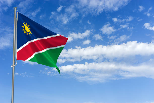 istock Republic of Namibia Flag Over Blue Sky Background. 3D Illustration 1454454019