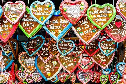 Munich, Germany - September 30:Typical ginger bread heart souvenir at a kiosk on the Oktoberfest (the world's largest folk festival) in Munich on September 30, 2022