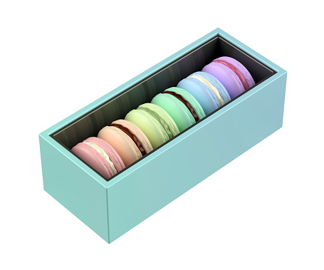 Box with six french macarons with different colors and flavors on white background
