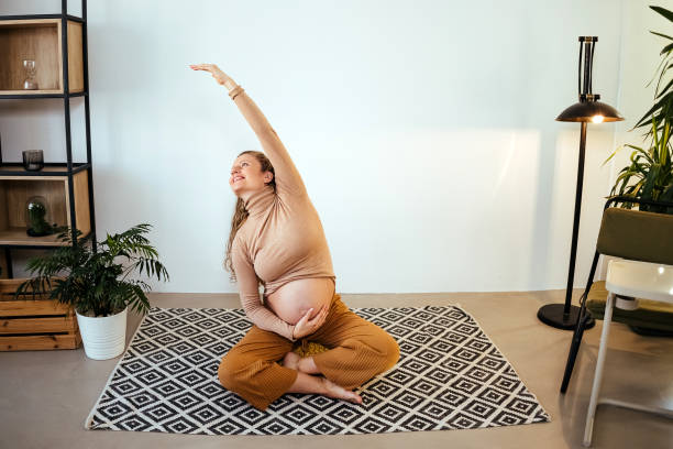 istock Future mother exercise yoga 1454465714