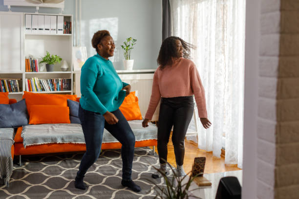 istock Happy Women Dancing At Home 1454468475