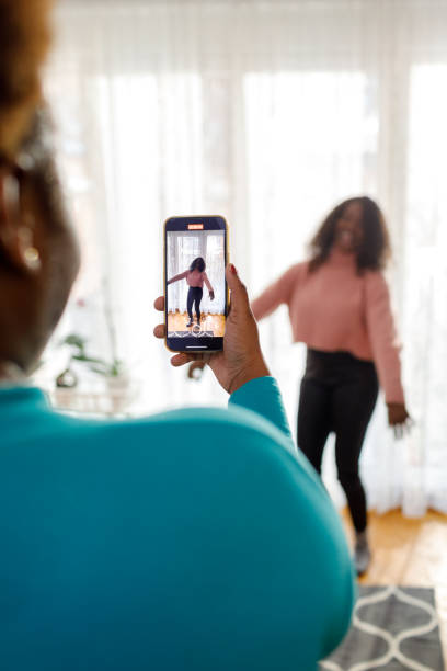 istock Two Black Women Make A Dancing Video 1454468485
