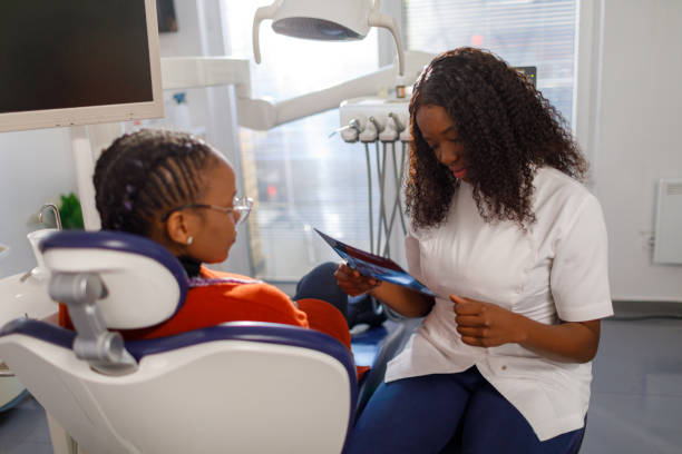 istock The Dentist Examines The X-Ray 1454469157