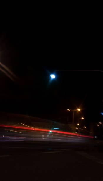 istock Light trail on the street at night 1454469517
