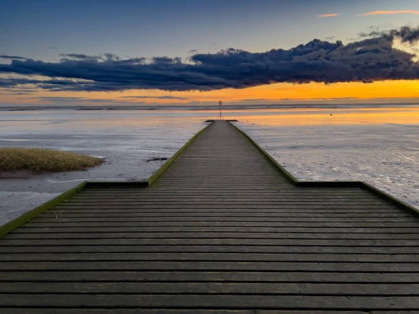 istock Jetty Leading Out To Sea 1454473301