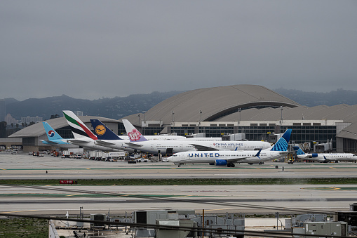 Los Angeles, CA USA - January 3, 2023: As Los Angeles braces for another powerful storm, this one referred to as a bomb cyclone, high winds cause a runway reversal at LAX.