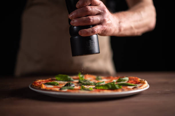 istock A male chef preparing pizza 1454475485