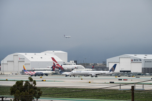 Los Angeles, CA USA - January 3, 2023: As Los Angeles braces for another powerful storm, this one referred to as a bomb cyclone, high winds cause a runway reversal at LAX.