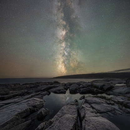 Night sky over Otter Point in Acadia National Park Maine