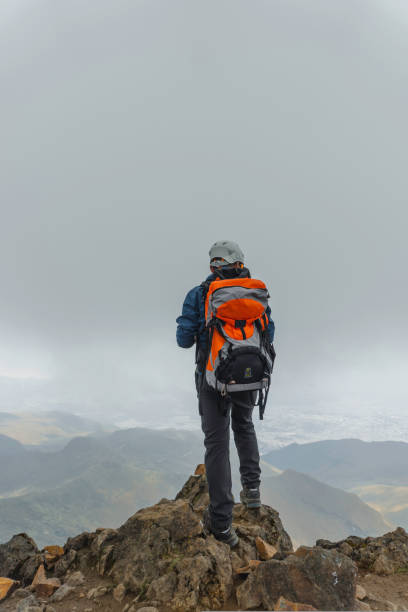 istock man hiker with backpack in front of a mountain 1454482113