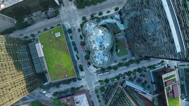 Unique rising and rotating aerial shot of the Amazon Spheres in Seattle's downtown area.