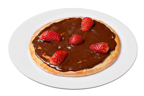istock Pizza. Small chocolate and strawberry pizza on white plate isolated on transparent background 1454487053