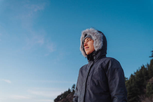 istock Woman enjoying winter walk in nature 1454497611