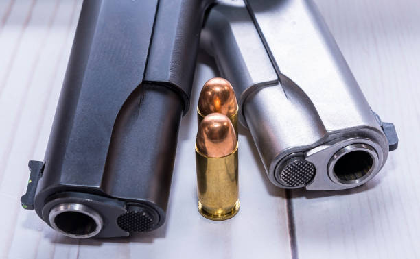 Two 1911 pistols with two bullets for them