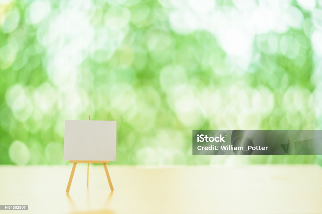 Blank small chart board, whiteboard with tripod stand holder for business presentation. Empty space for drawing specific information as needed e.g. market share growth, corporate earnings goals, etc Sponsor Stock Photo