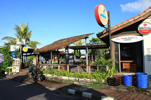 View from the street of Cafes, Restaurant and Beach Bars at Batu Bolong Beach in Canggu, Bali, Indonesia.