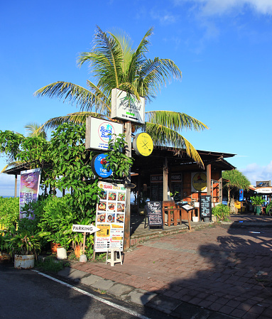 View from the street of Cafes, Restaurant and Beach Bars at Batu Bolong Beach in Canggu, Bali, Indonesia.