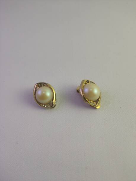 istock Pure white pearl earrings 1454505582