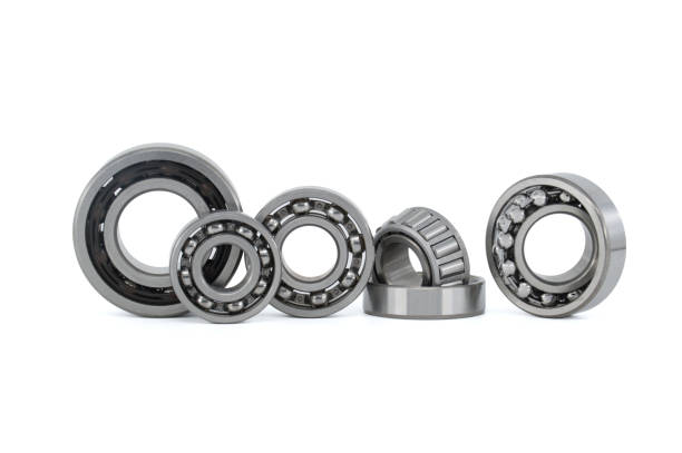 istock Group of various ball and roller bearings on white 1454509635