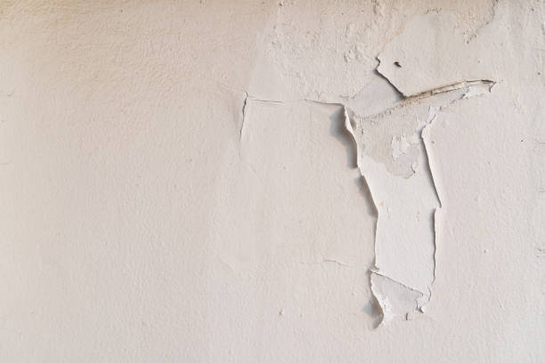 istock Water damaged wall in an old house. Water damage building interior. 1454510837