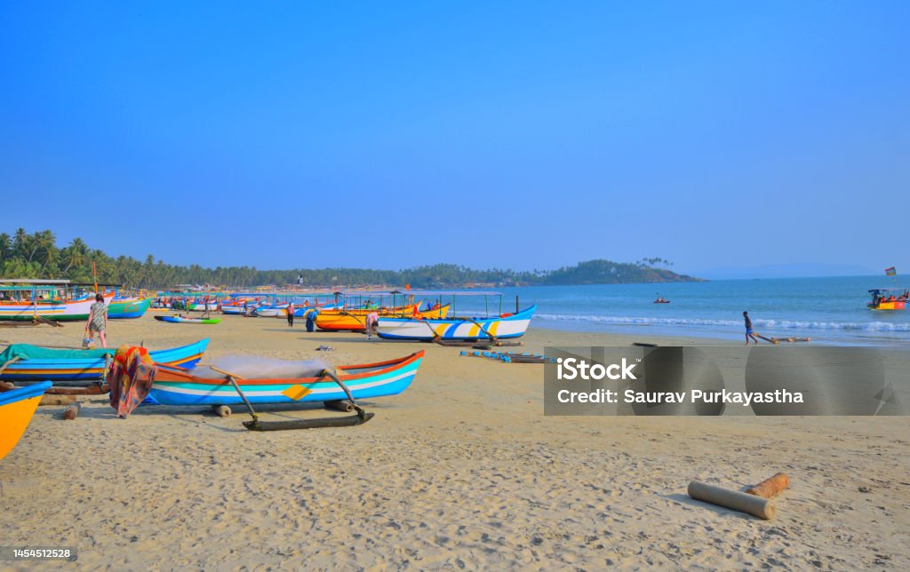 Colourful tourist boats kept in Palolem beach in Goa. Arabian Sea Stock Photo