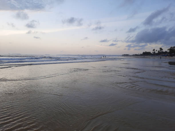 istock sunset reflections on the beach. sky reflections on the water. 1454513984