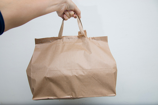 Diet nutrition and brown paper bag package with copy space, Healthy food delivery from a restaurant.