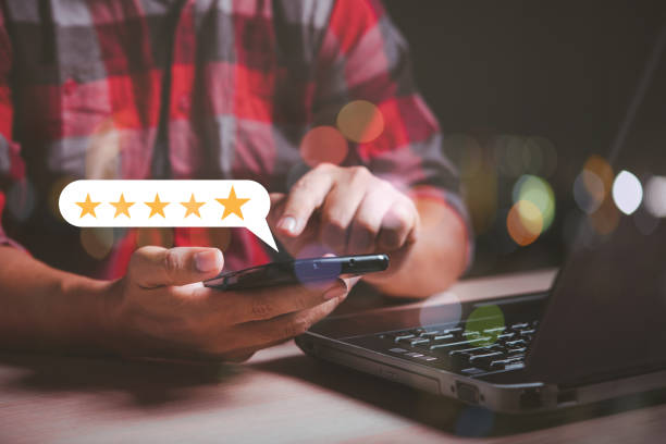 istock man hand using smart phone giving 5 star rating , customer satisfaction concept 1454520169