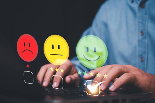 istock The guy selects green 5 star smile rating icon from the options on the virtual screen 1454520724